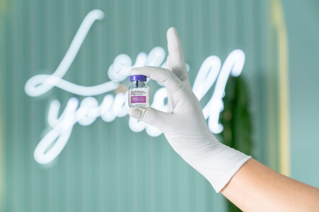 A Person Holding a Vial